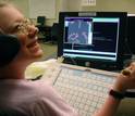 student in a wheelchair uses adaptive keyboard